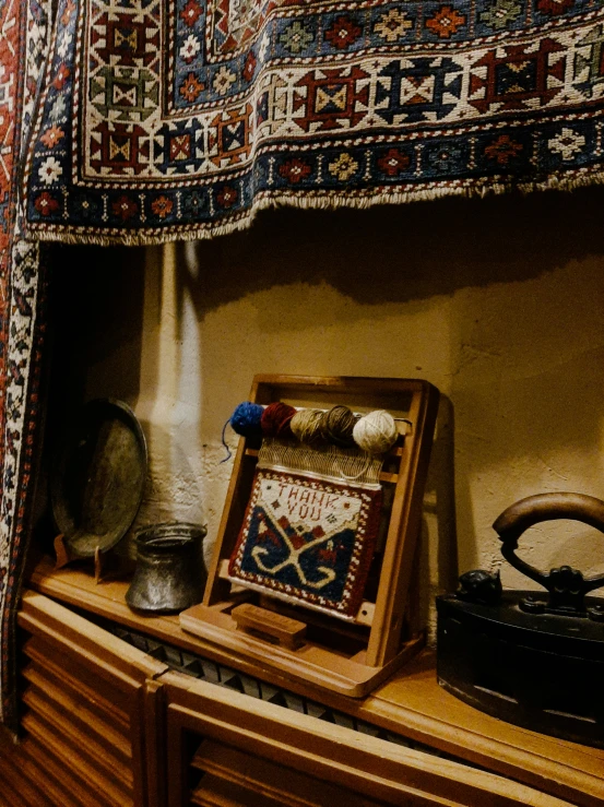 an antique sewing machine next to a quilt