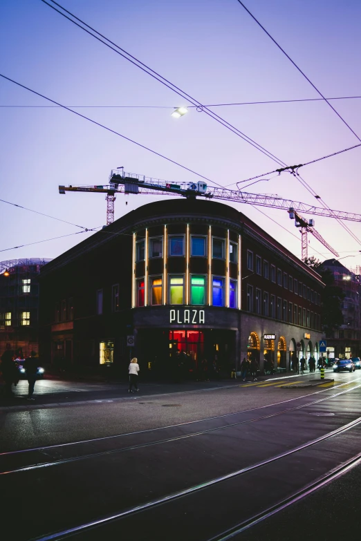 a po of a street with a very bright building next to it