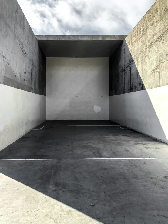 an empty concrete square has the door opened