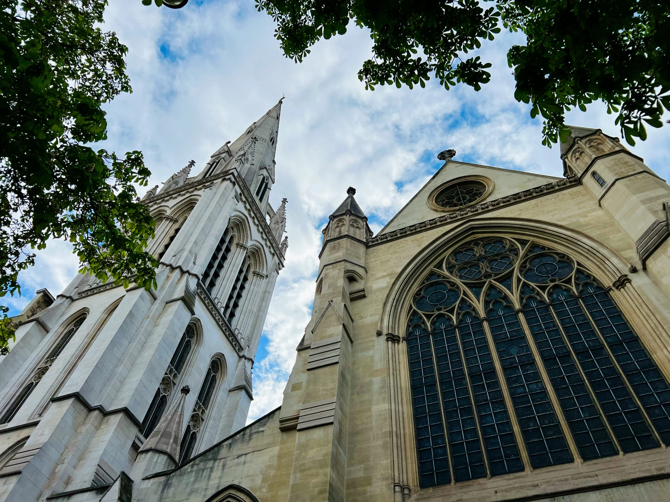 a stone church with tall steeples and arched windows