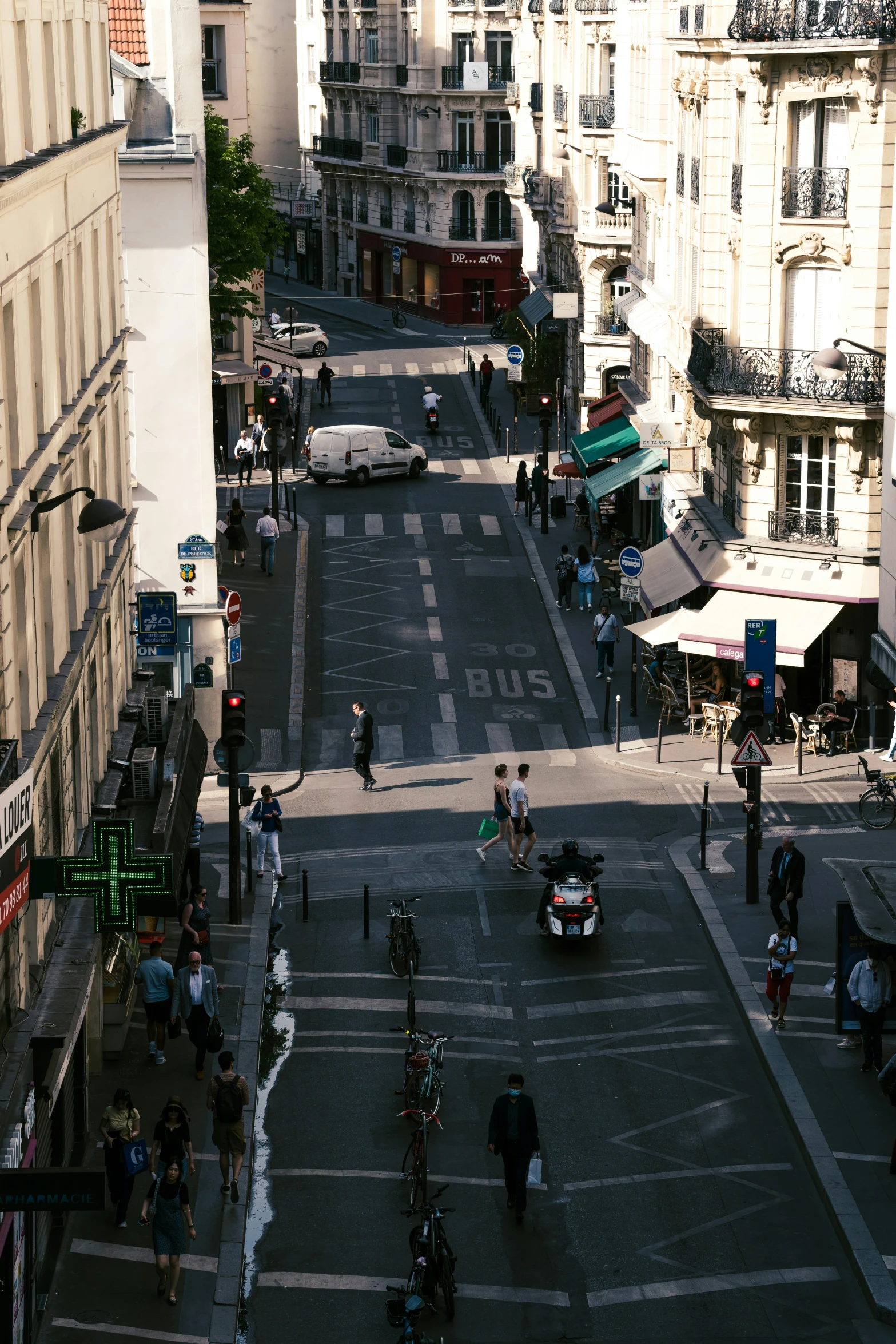 there are people walking down the street of an asian city