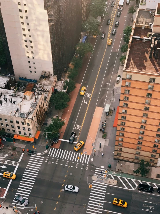 a large street intersection with traffic at crosswalks