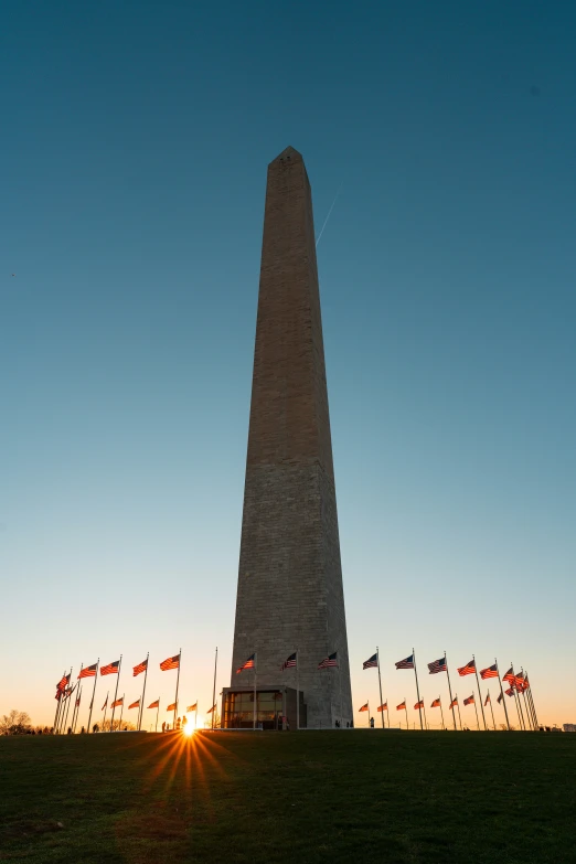 there are many flags that are on the side of this building