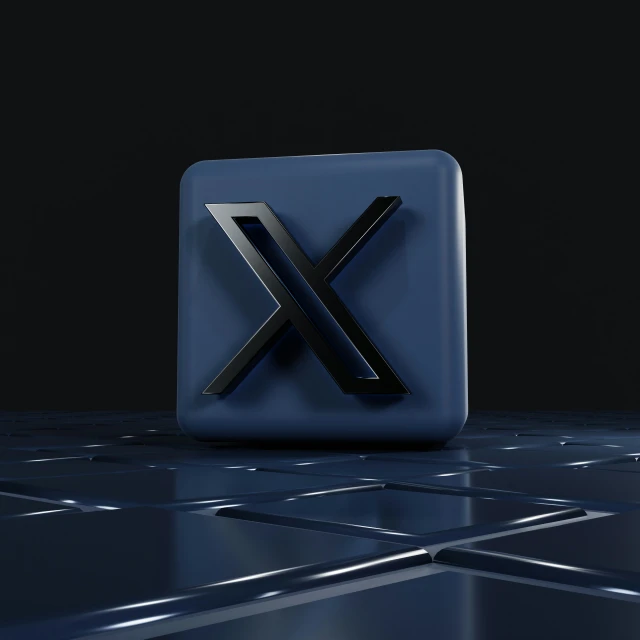 a 3d image of a x logo made of black metal