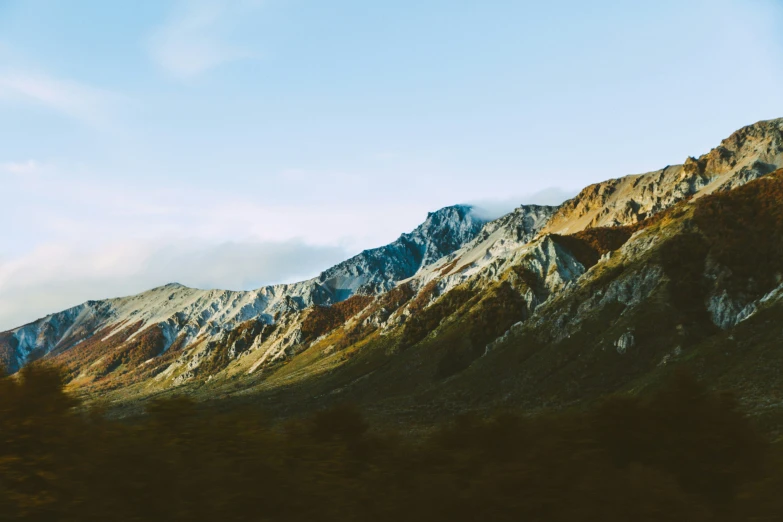 the mountains are beautiful, and clouds are making their way down