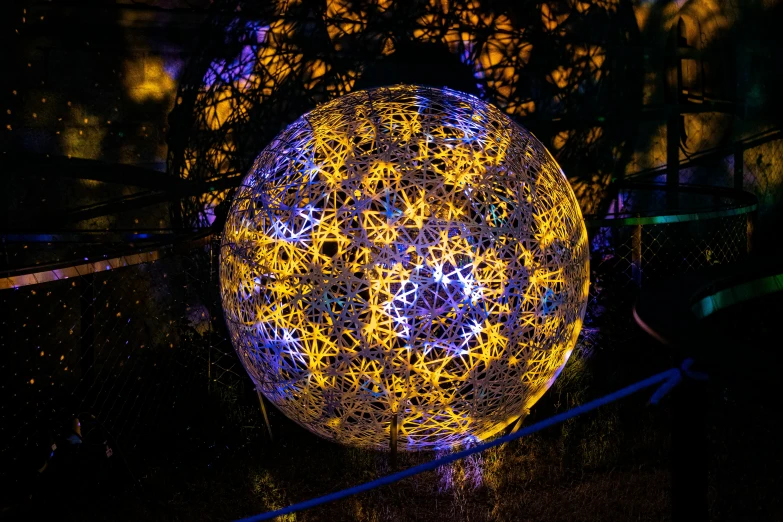 the ball with the yellow dots is glowing in the dark