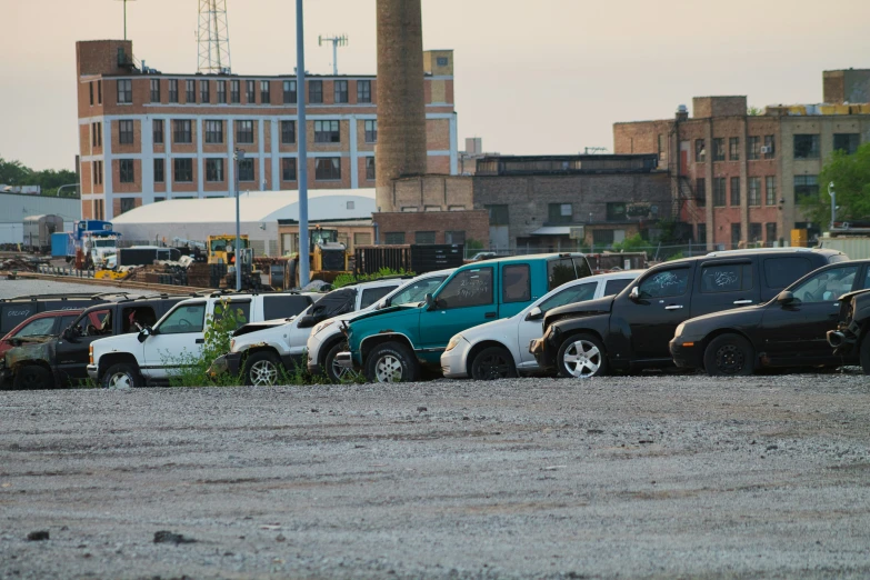 a lot full of dirty, abandoned and abandoned vehicles