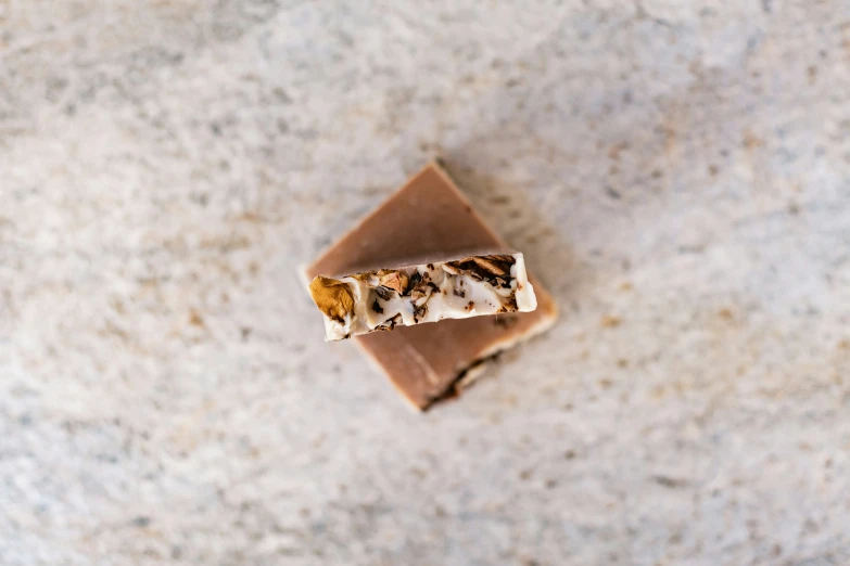 two pieces of brown and white desert type food