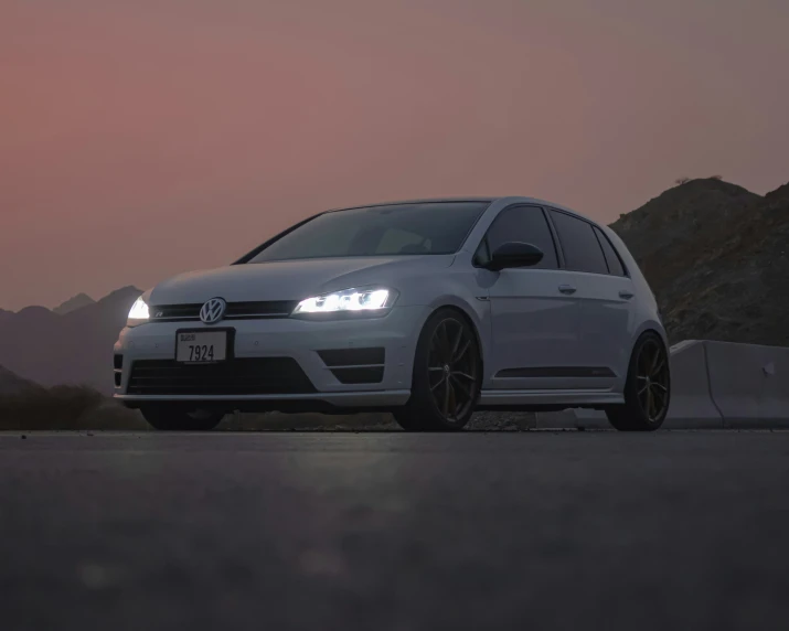 the volkswagen golf gt4 is shown on the side of the road