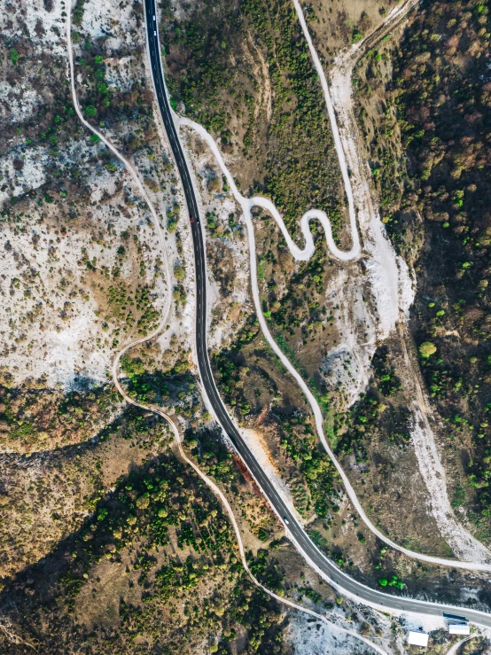 the long stretch of road has white markings on it