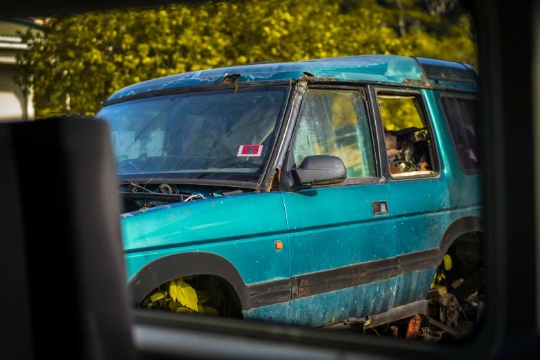 the dog is in the truck with the hood up