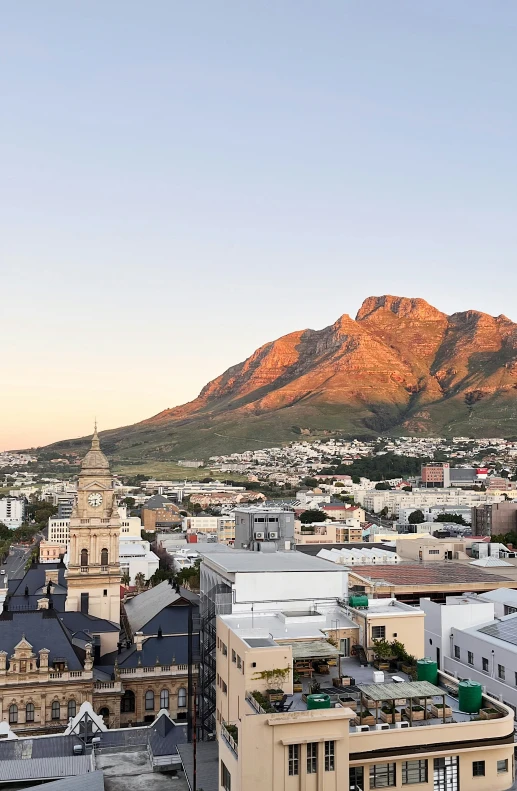 a view of a large mountain with the city below