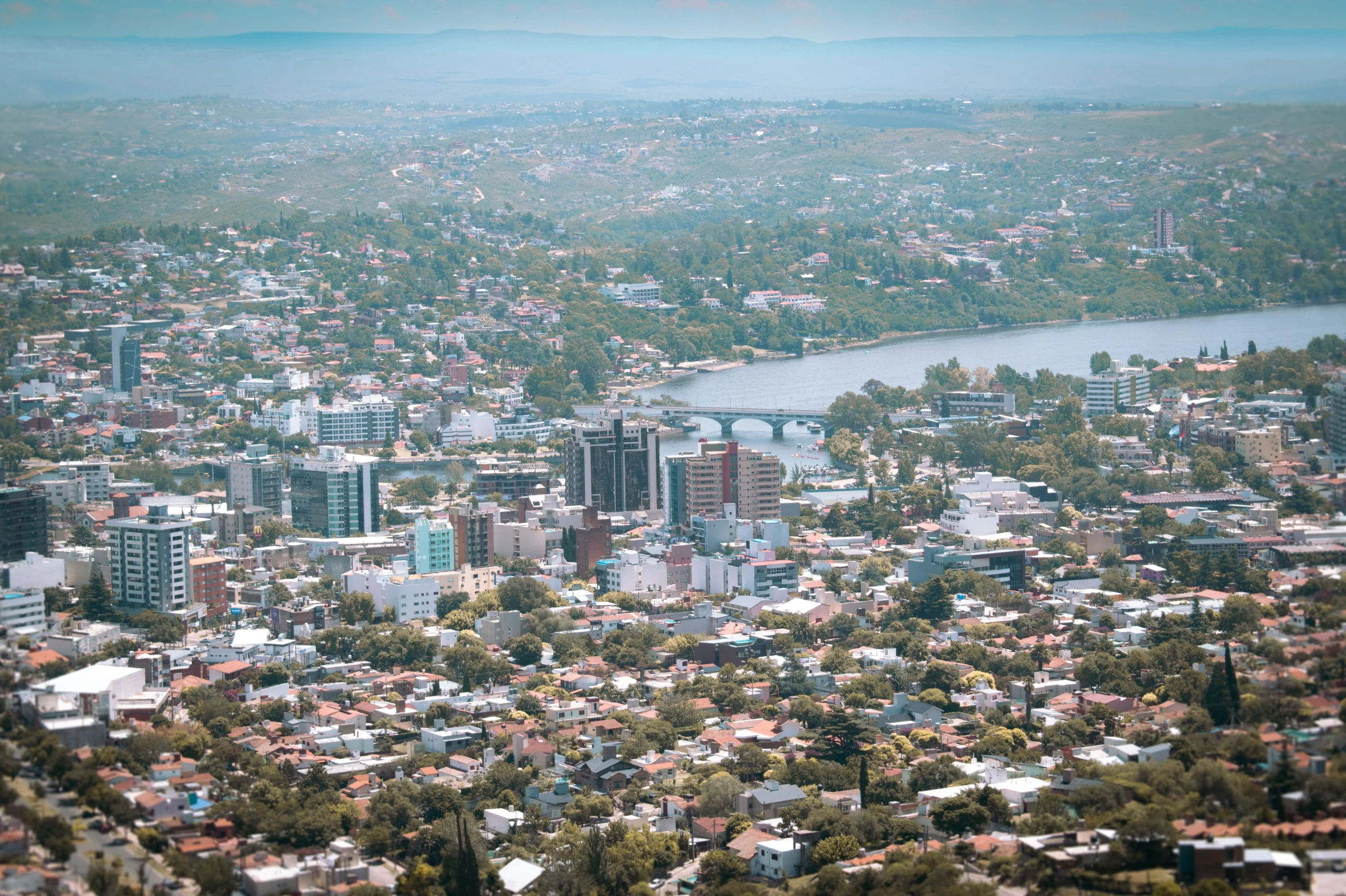 a city from the air with buildings on both sides of it