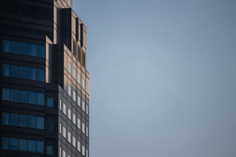 the plane is flying overhead over a building