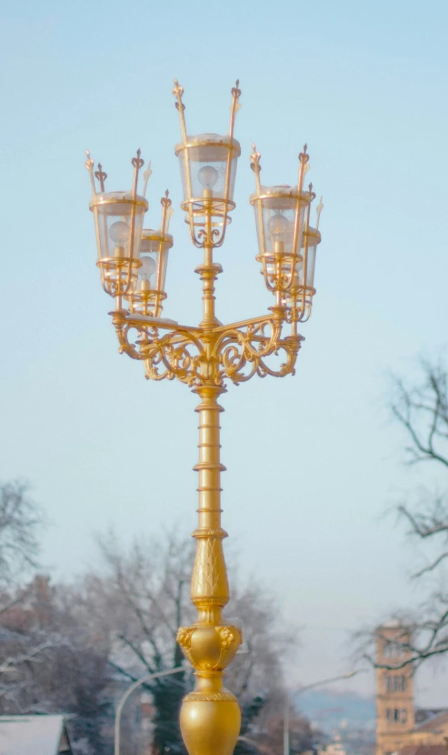 a ss street light with several lanterns on top