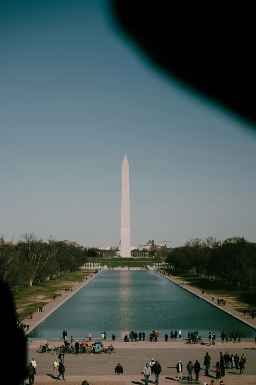 there is a large fountain with people near it