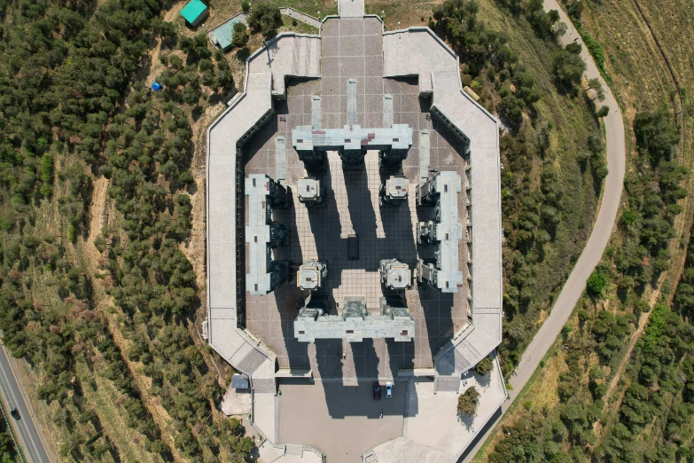 an aerial s of a castle that is surrounded by trees