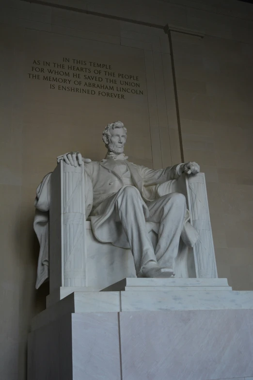 the lincoln memorial with the statue reading the time