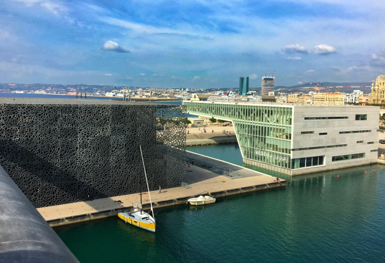 the buildings and docks are visible from the water