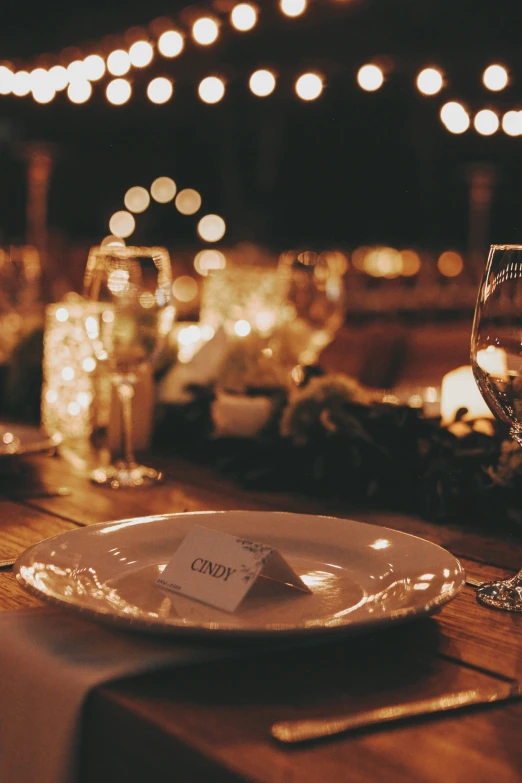 a place setting with many different dinnerware