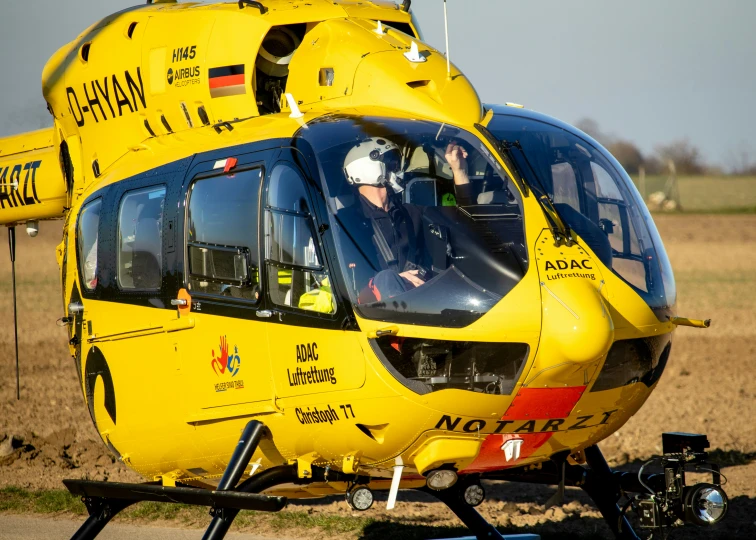 a large yellow helicopter is being transported to the rescue area