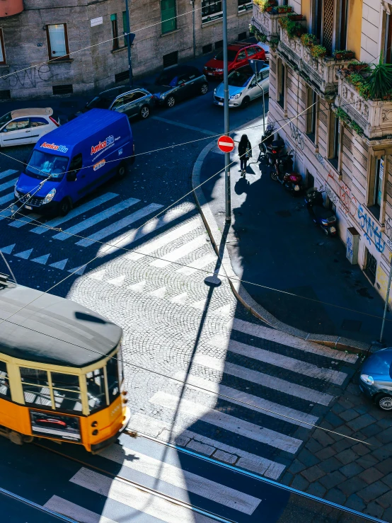 a bus is driving down the road near a building