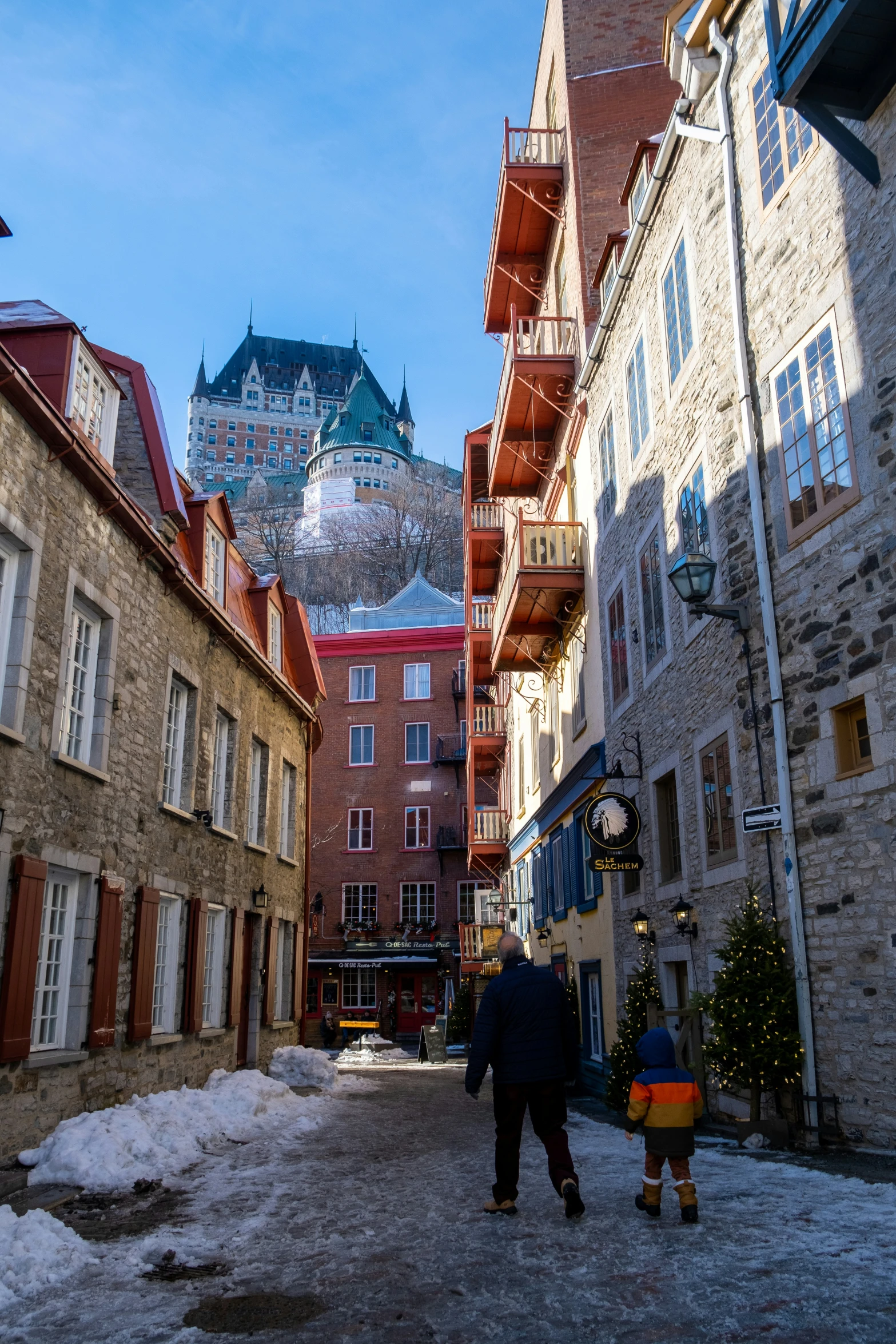 a person is walking in an alley in the winter