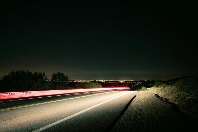 the long exposure pograph shows an almost empty highway