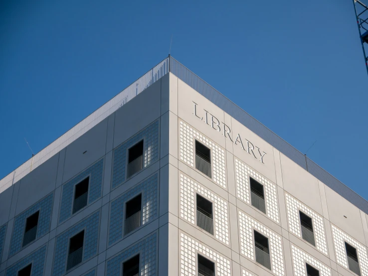 a building with a crane in the air next to it