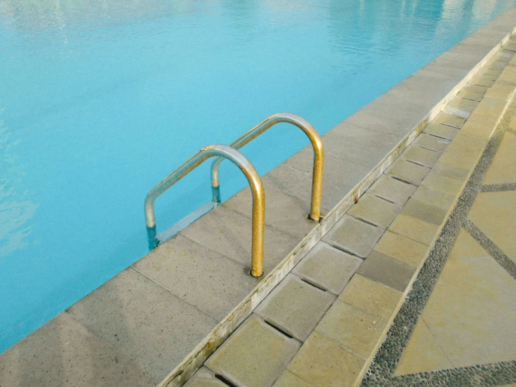 swimming pool with a ramp for people to stand on