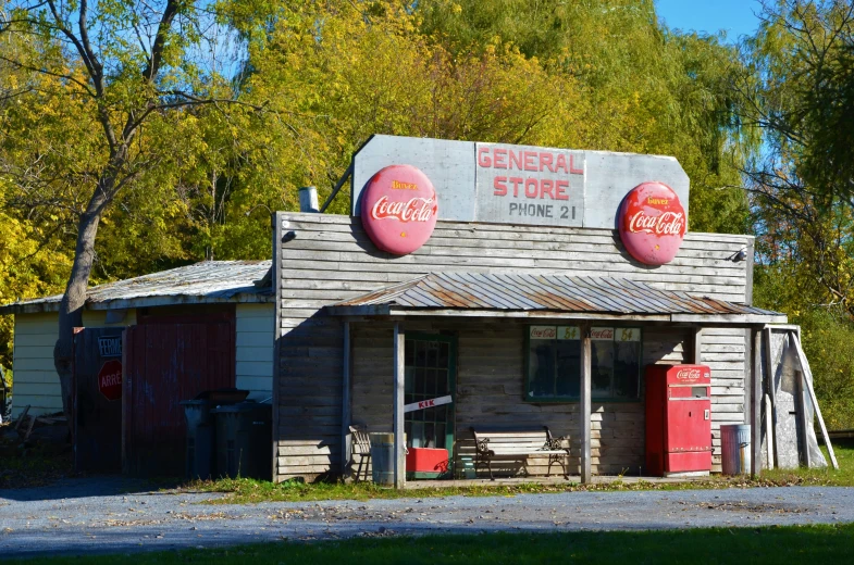 a storefront sign sitting in front of a building