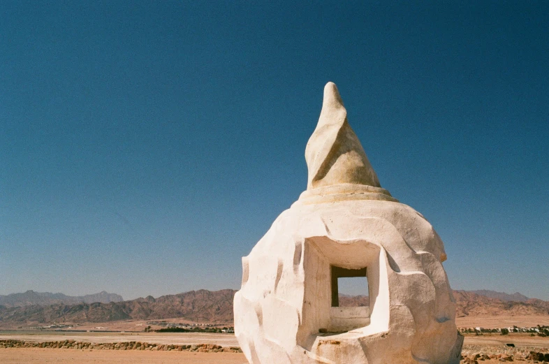 a stone sculpture in the middle of nowhere