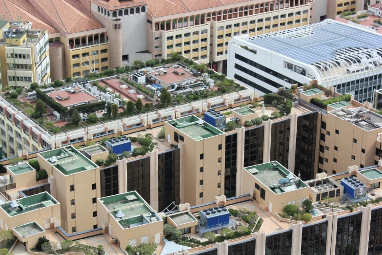 an aerial view of a building with green roof top