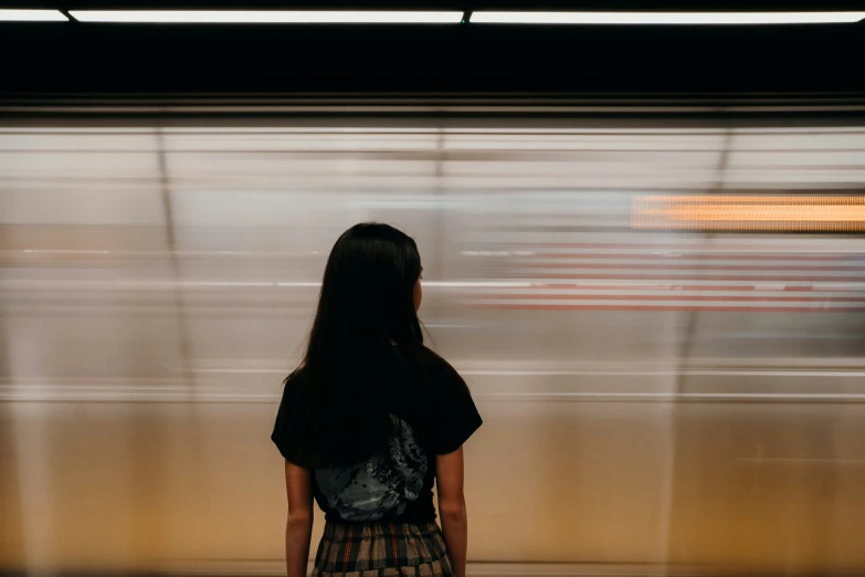 a person watching the train as it goes by