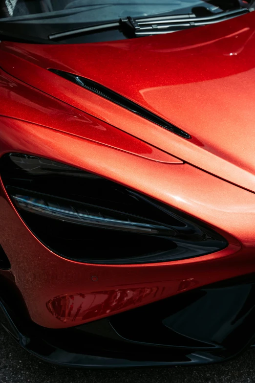 close up of an orange sports car parked