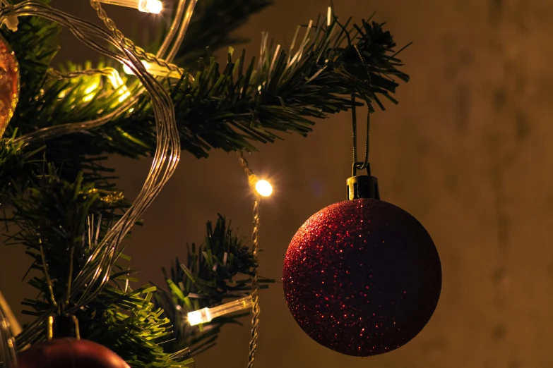 a close - up of a christmas tree with ornaments and lights