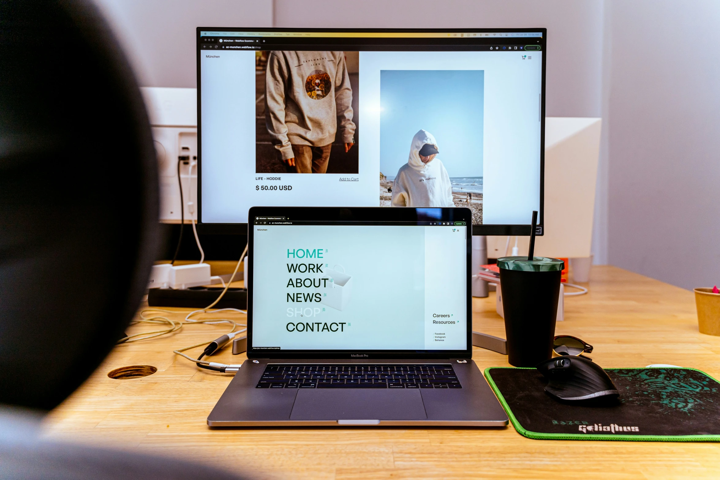 a monitor, keyboard and mouse are set up on a wooden desk