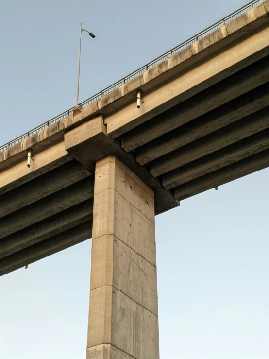 an elevated freeway bridge against a clear sky