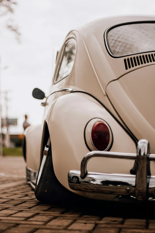 the front end of a car parked on the road