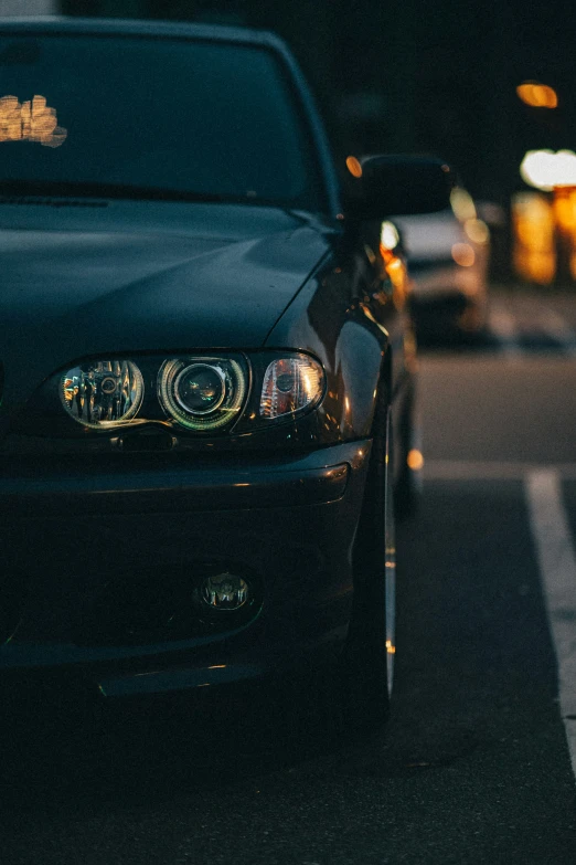 the front end of a car in the parking lot