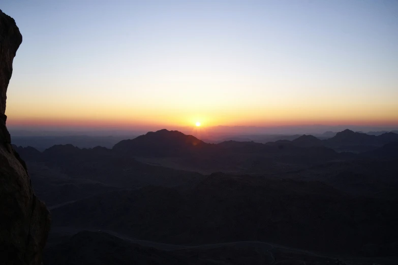 a beautiful sunrise as seen from a top of a mountain