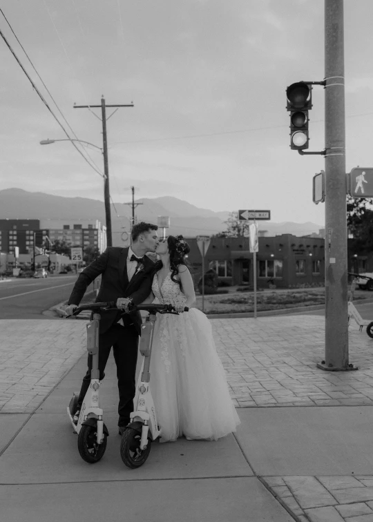 a man and woman kissing on the street