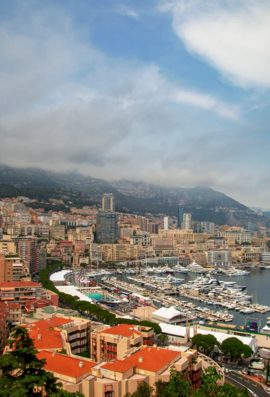 the harbor in a city has many boats docked near them