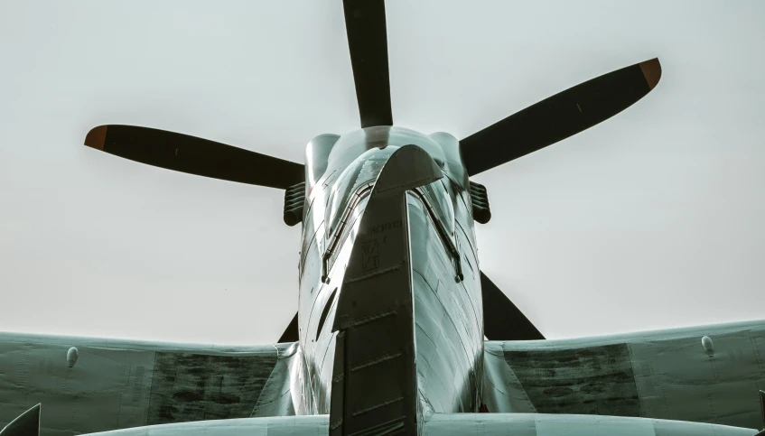 an airplane with its propeller showing from the inside