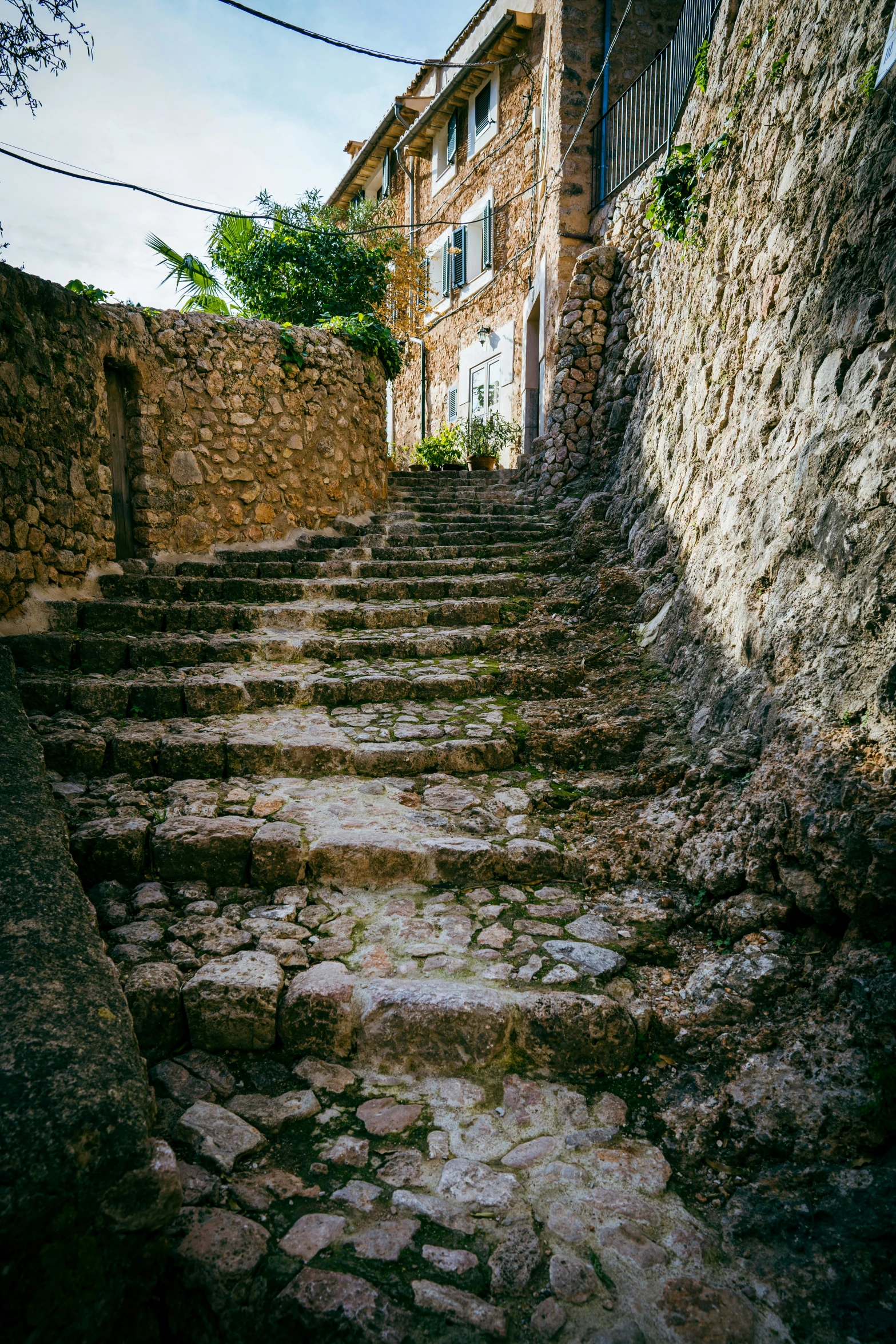 the stone steps leading up to the apartment building