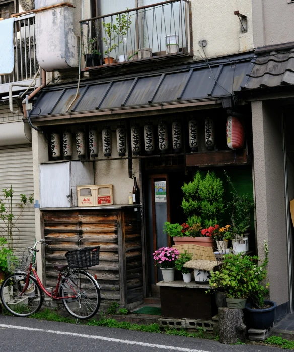 a bicycle parked outside of an old run down building