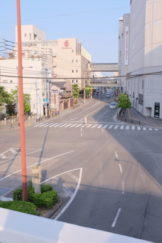 a street has a crosswalk and sign posts