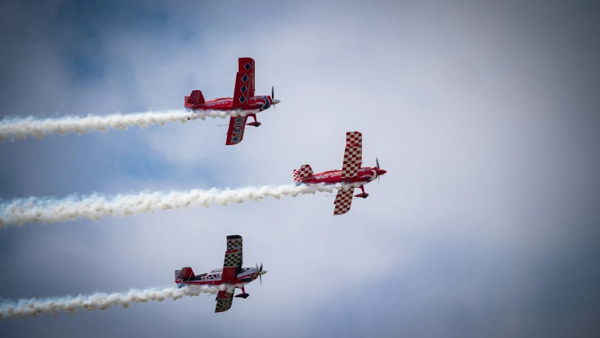 four airplanes flying in unison into the sky