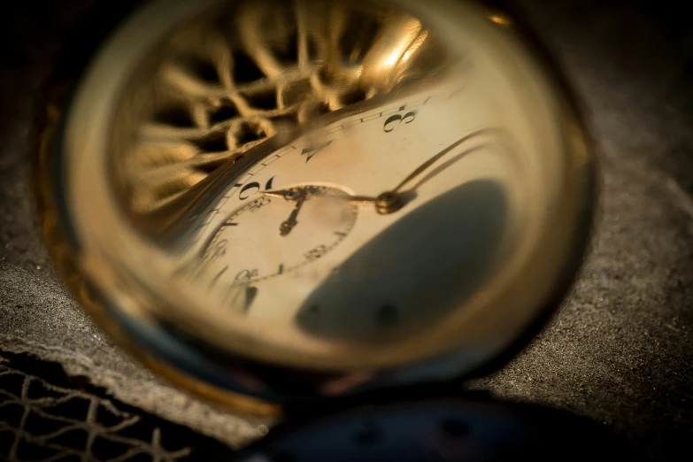 an old ss pocket watch sitting on a table