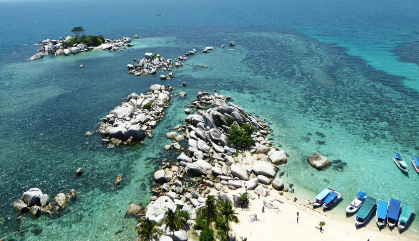 boats are parked on the water in the ocean